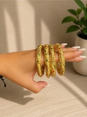 Touchstone Crystal Gold Tone Bangles with Green & Red Crystal Accents